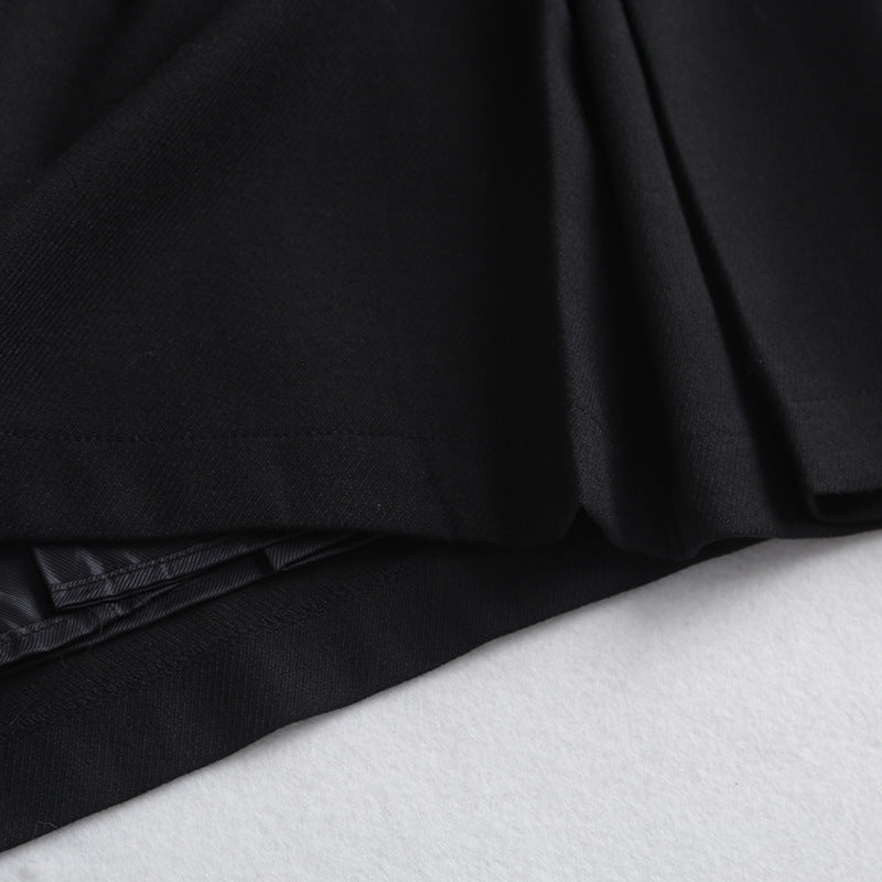 Clara – Wide Pleated Skirt with Chain Decoration